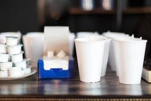 A group of empty coffee cups to serve tea or coffee at an event buffet photo