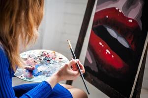 Female student having classes at art studio, to draw. photo