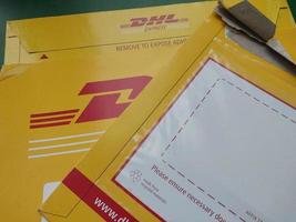 KIEV, UKRAINE - DECEMBER 10, 2022 Mail envelope service DHL photo