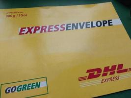 KIEV, UKRAINE - DECEMBER 10, 2022 Mail envelope service DHL photo