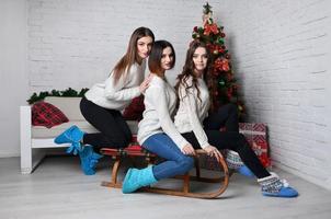 Young girls with sleigh photo