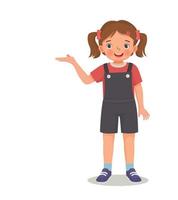 cute little girl showing presenting with hand for copy space vector