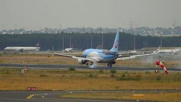 FRANKFURT AM MAIN, GERMANY JULY 20, 2017 - TUIFly Boeing 737 D ATUR landing at runway 25L, slow motion. Fraport, Frankfurt, Germany video