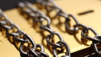 Close up of metal chain links conveying the message of power or entrapment video