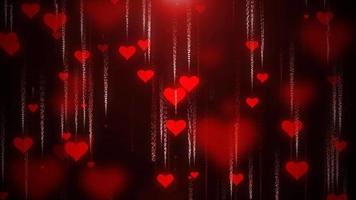 Festive red love background of flying down hearts with blur and glow effect and particles for Valentine's Day. Abstract background. Video in high quality 4k, motion design