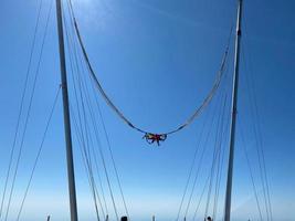 Extreme slingshot ride attraction in the city park photo