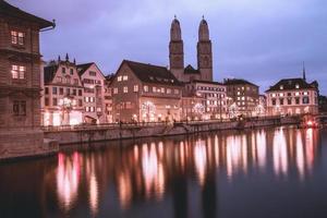 View of Grossmunster Church across the Limmat River in Zurich, Switzerland photo