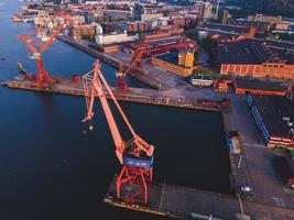 Cranes at sunrise seen in Gothenburg, Sweden photo