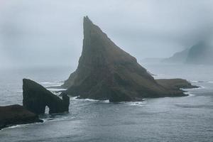 Drangarnir and Tindholmur in the Faroe Islands photo