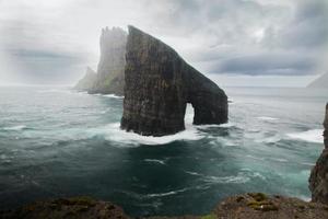 Drangarnir and Tindholmur in the Faroe Islands photo