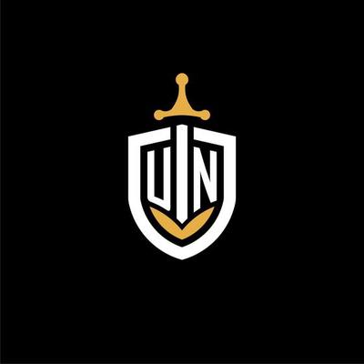 Creative letter UN logo gaming esport with shield and sword design ideas