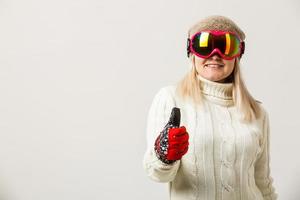 Feeling playful. Happy holyday. Ski resort and snowboarding. Sexy woman in winter clothes. Happy winter holidays. Winter sport and activity. Ski boots and glasses. Girl in ski or snowboard wear. photo