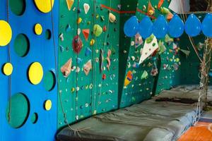 Climbing gym. Colorful footholds for training photo