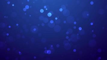 Shiny particles floating on abstract blue background, bokeh particles flying slowly video