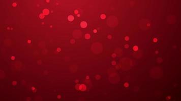 Shiny particles floating on abstract red background, bokeh particles flying slowly video
