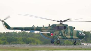 NOVOSIBIRSK, RUSSIA JUNE 10, 2020 - Military helicopter Mi 8 takes off and hovers in the air in Tolmachevo Airport, Novosibirsk video