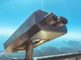 observation deck with binoculars. large, metal magnifier of the surrounding world. panoramic binoculars for tourists, observation of the surrounding world