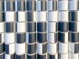 Texture of black and white cylinders and squares for counting on the playground for children. The background photo