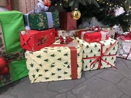 Christmas presents in multi-colored boxes photo