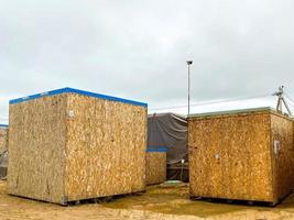 compressed sawdust are in a cube. a convenient form for sending building sawdust to production. sawdust with a roof for loading into trucks photo