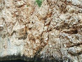 mountain texture, gray stone with a volumetric 3D structure. background with natural material. rock of sand and stone, solid mountain rock photo
