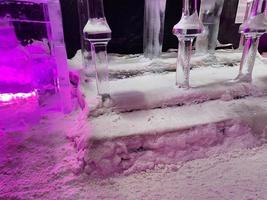 Large transparent winter ice sculptures and figures, columns at the festival. photo