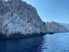 Beautiful view of the blue sea and high rocky mountains in a tourist tropical country for vacation photo