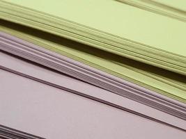 Stacks of yellow and pink HVS papers. photo