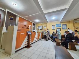 Central Java, Indonesia in October 2022. Several people are queuing and waiting at the BPKB service office or vehicle certificate of ownership at the Jepara Police photo