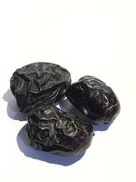 Isolated photo of three ajwa dates. Ajwa dates or also known as Prophetic Dates.