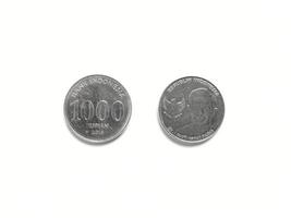 Indonesian's Rupiah coin with value 1000 Rupiah released in 2016 with picture of Indonesian's national hero. Taken from front and back sides photo