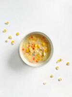 Healthy egg drop soup with sweet corn, tuna, and carrot for baby photo