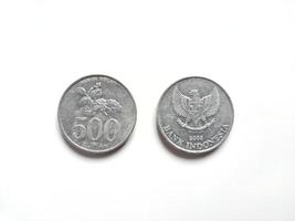 Indonesian's Rupiah coin with value 200 Rupiah released in 2008 with symbol Jalak Bali or Bali Myna bird in front side. Jasmine flower is a name of local flower in Indonesia photo