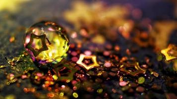 Macro Shot Of Water Drop On Glitter In Karachi Pakistan 2022 photo