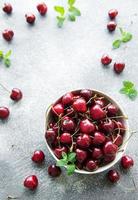 Fresh red cherries fruit in bowl photo
