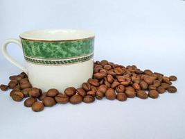 coffee cup and coffee beans on white background photo