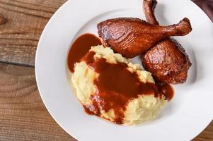 Barbecue duck legs with mashed potato photo