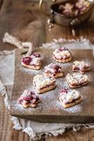Shortbread biscuits with cherry filling photo