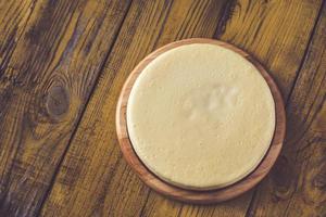 Traditional cheesecake on the wooden table photo