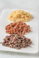 Three types of cooked quinoa photo