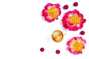 Cup of coffee with flowers on white background. photo