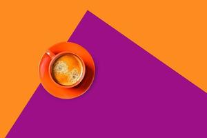 One cup of coffee on two-toned background. photo