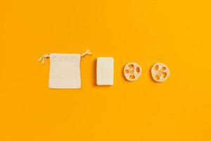 Zero waste accessories on yellow background. photo