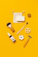 Zero waste accessories on yellow background. photo