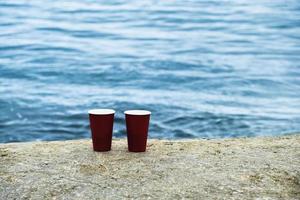 Two cups of coffee on a nature background. photo