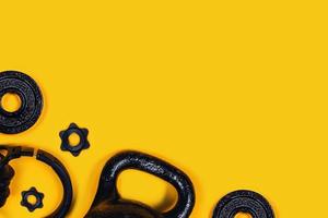 Kettlebell and headphones on color background. photo