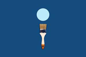 Blue background with paint brush on a circle. photo