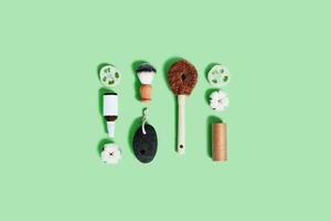 Zero waste accessories on mint green background. photo