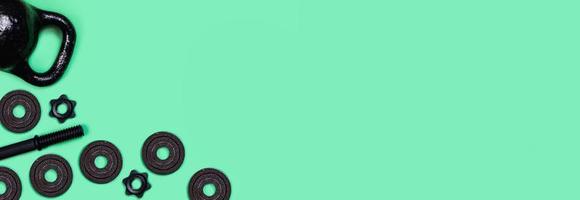 Kettlebells and dumbbells on color background. photo