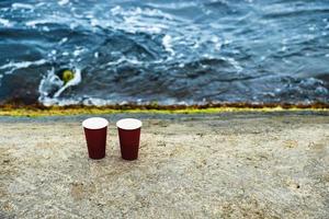 Two cups of coffee on a nature background. photo